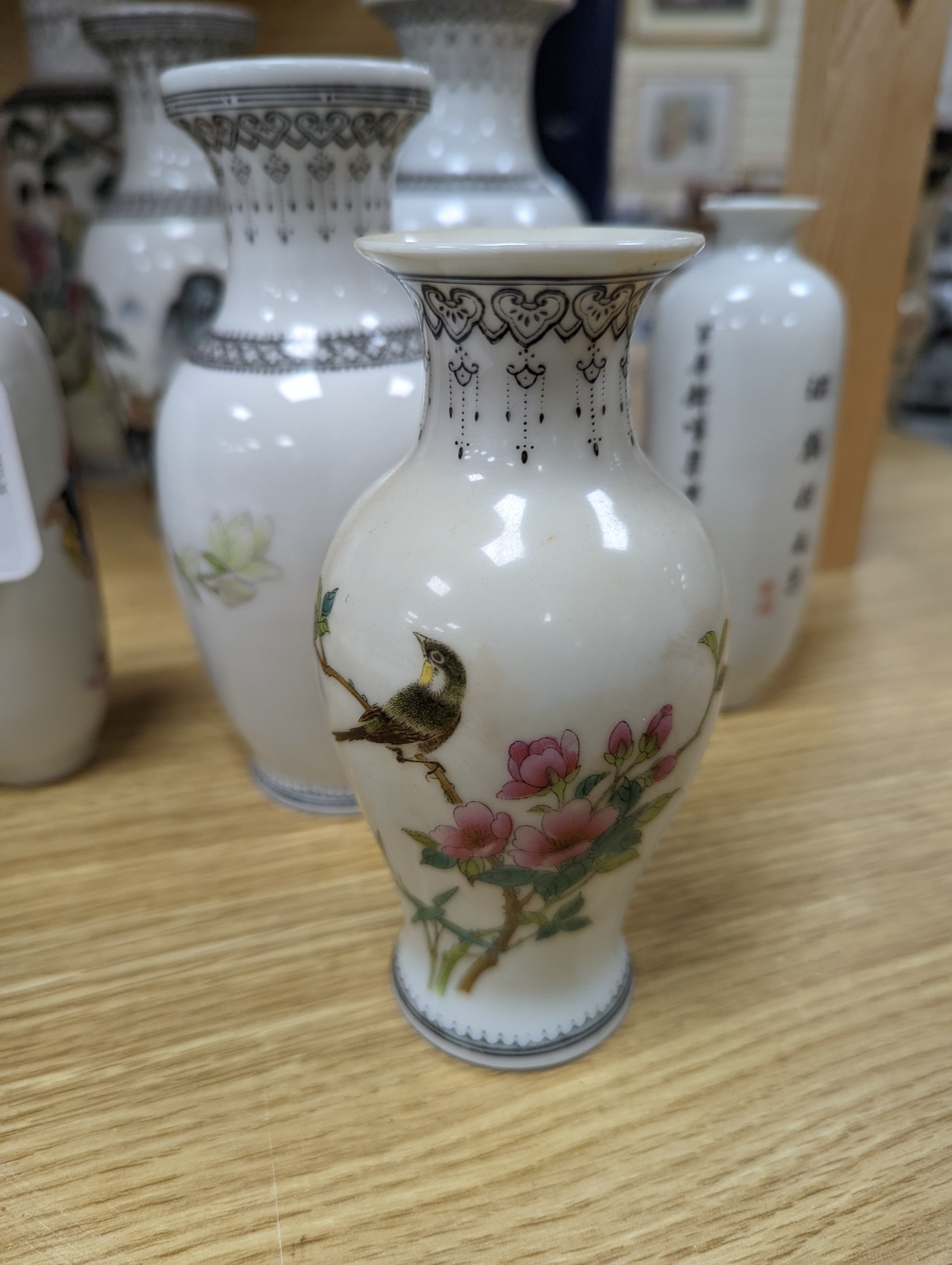 A group of seven Chinese famille rose vases, 20th century